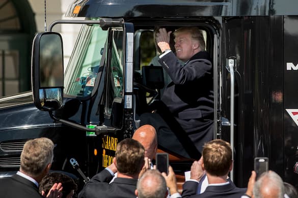 AP/Andrew Harnik, file President Trump honks the horn of an 18-wheeler truck at the White House, March 23, 2017.