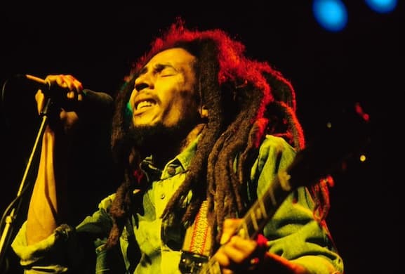 Mike Prior/Redferns via Getty Images Bob Marley performs at the Brighton Leisure Centre.